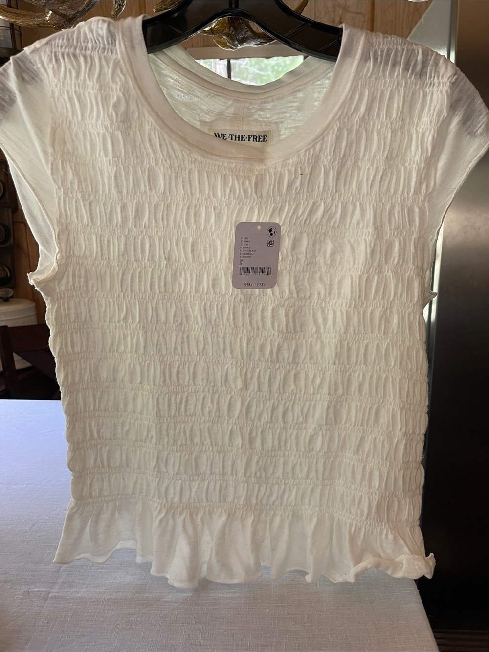 Free People New cap sleeve tee in light beige. Size small